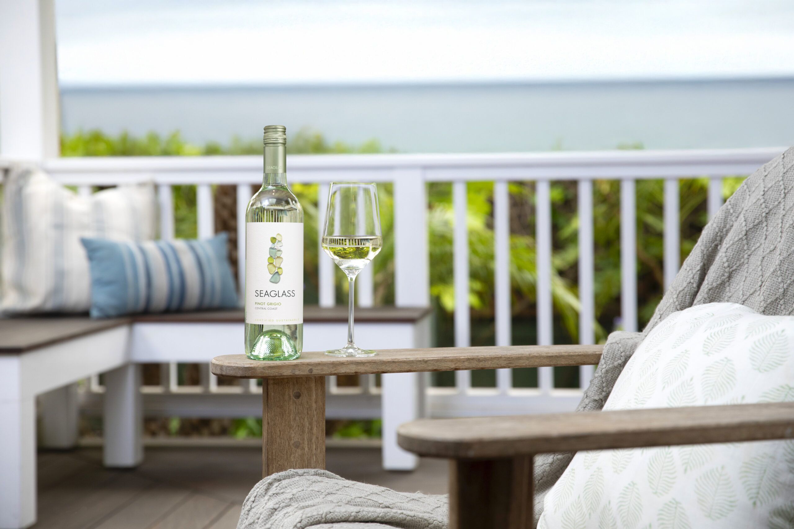 SEAGLASS Pinot Grigio bottle on armchair on patio