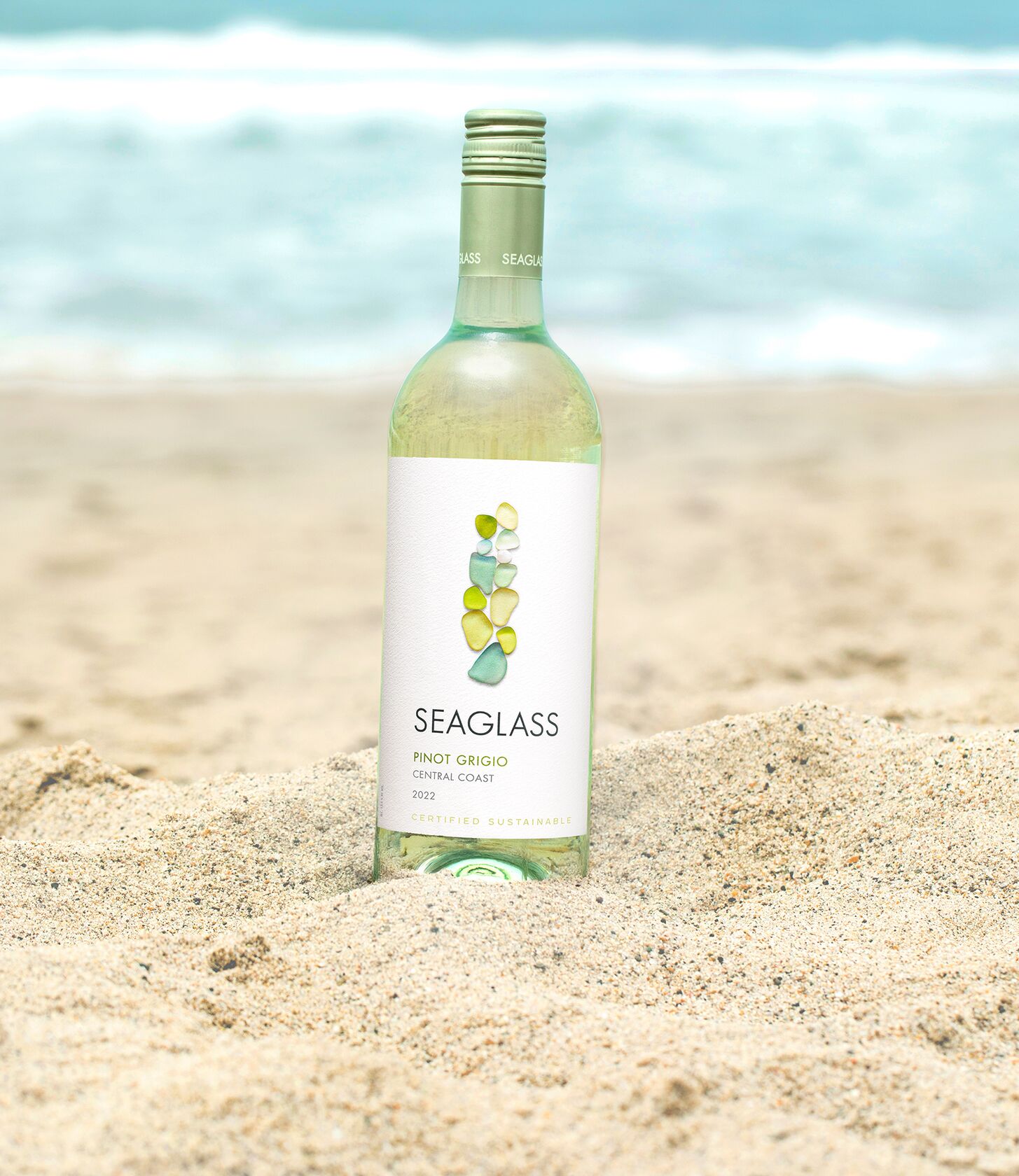 SEAGLASS Pinot Grigio bottle in sand
