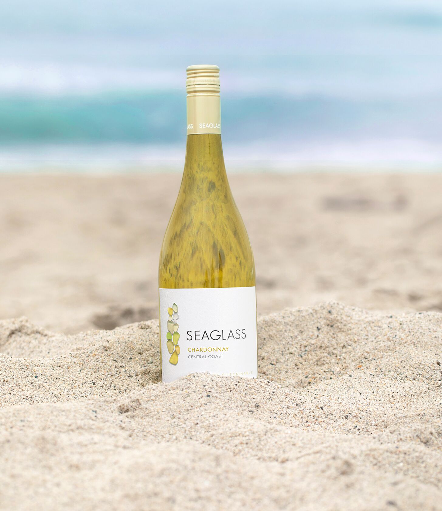 SEAGLASS Chardonnay bottle in sand