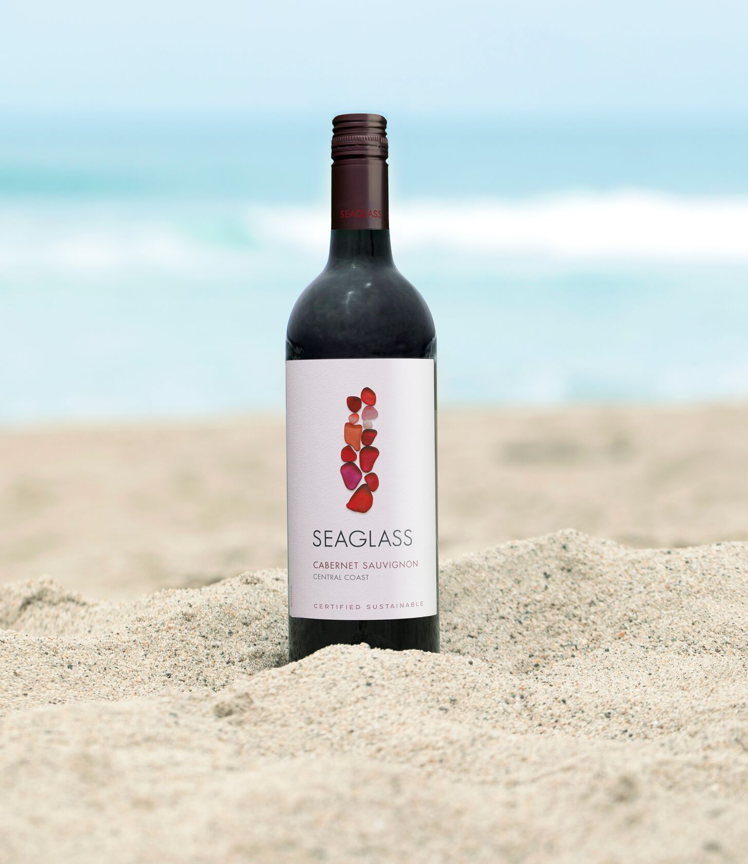 SEAGLASS Cabernet Sauvignon bottle in sand