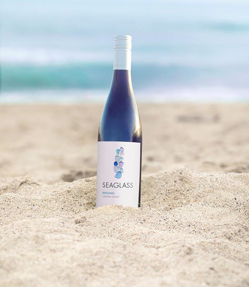 SEAGLASS Riesling bottle in sand